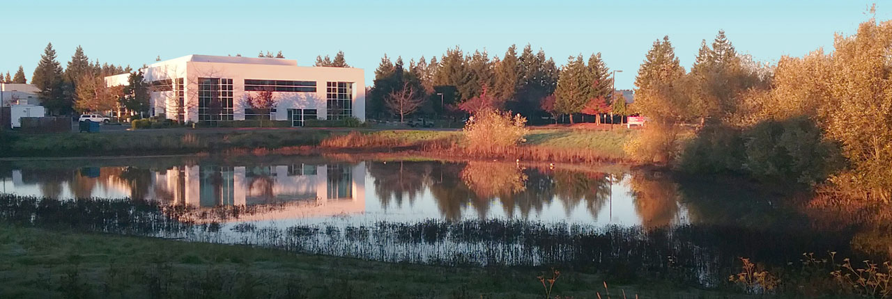 The Sonoma Technology office behind a small lake